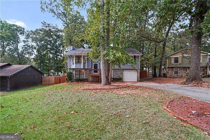 4 bedroom, 2.5 bathroom, 2,141 sq ft single family residence for sale at 1955 Woodlot Trail, Lithonia, GA 30058 — photo 4