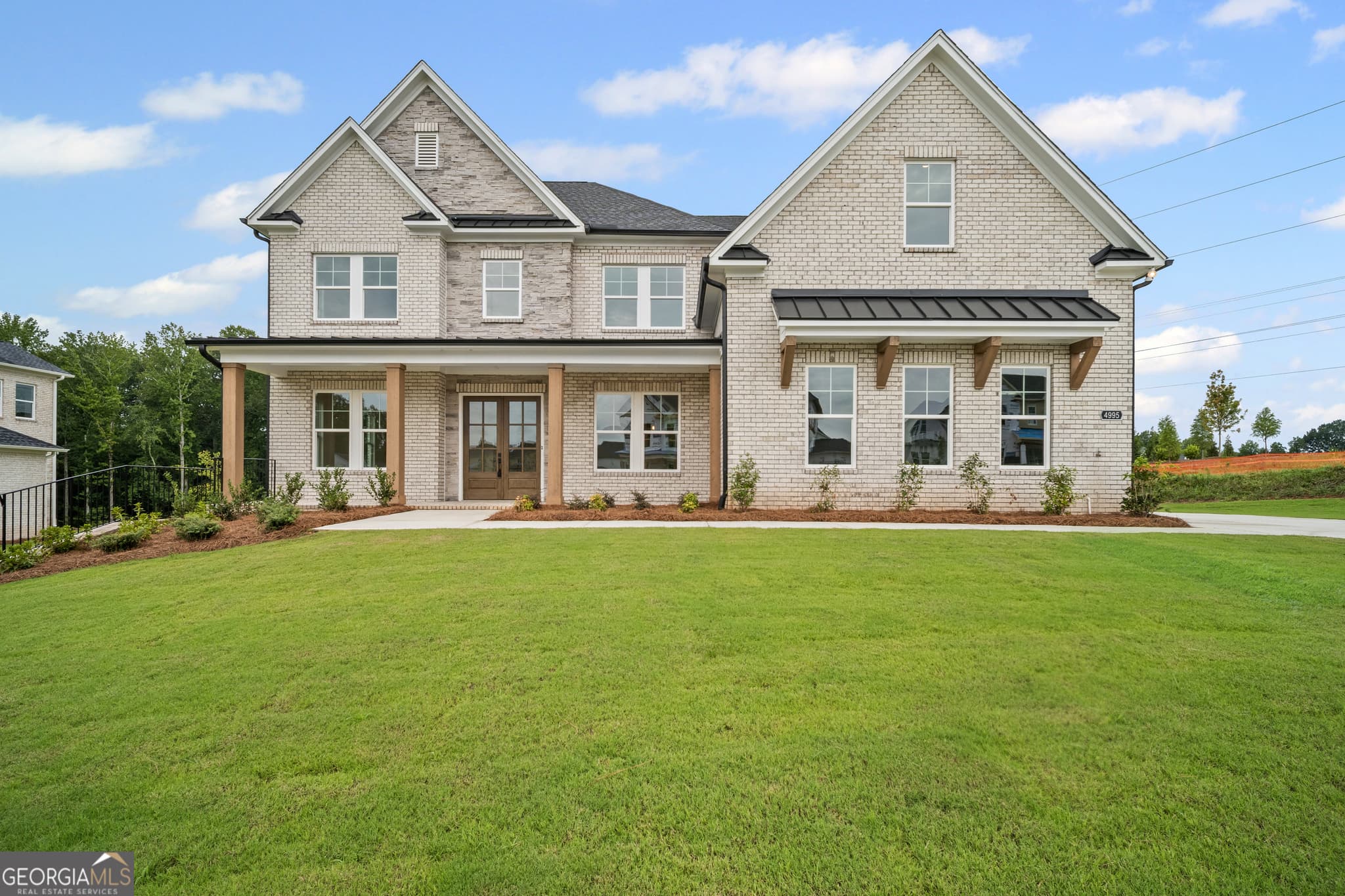 5 bedroom, 5 bathroom single family residence sold at 4995 Travers Lane, Cumming, GA 30040