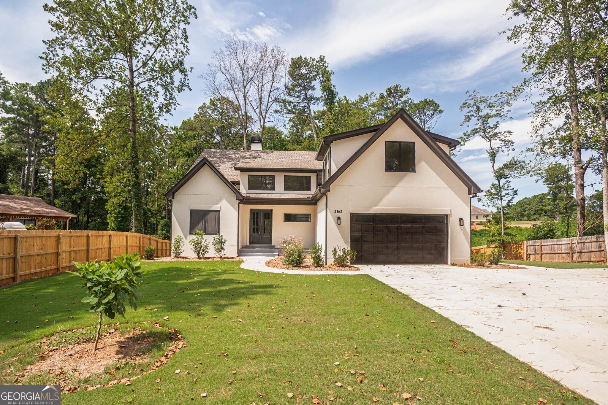 4 bedroom, 3 bathroom, 3,000 sq ft single family residence for sale at 2162 Plantation Road, Lawrenceville, GA 30044 — photo 1 of 56