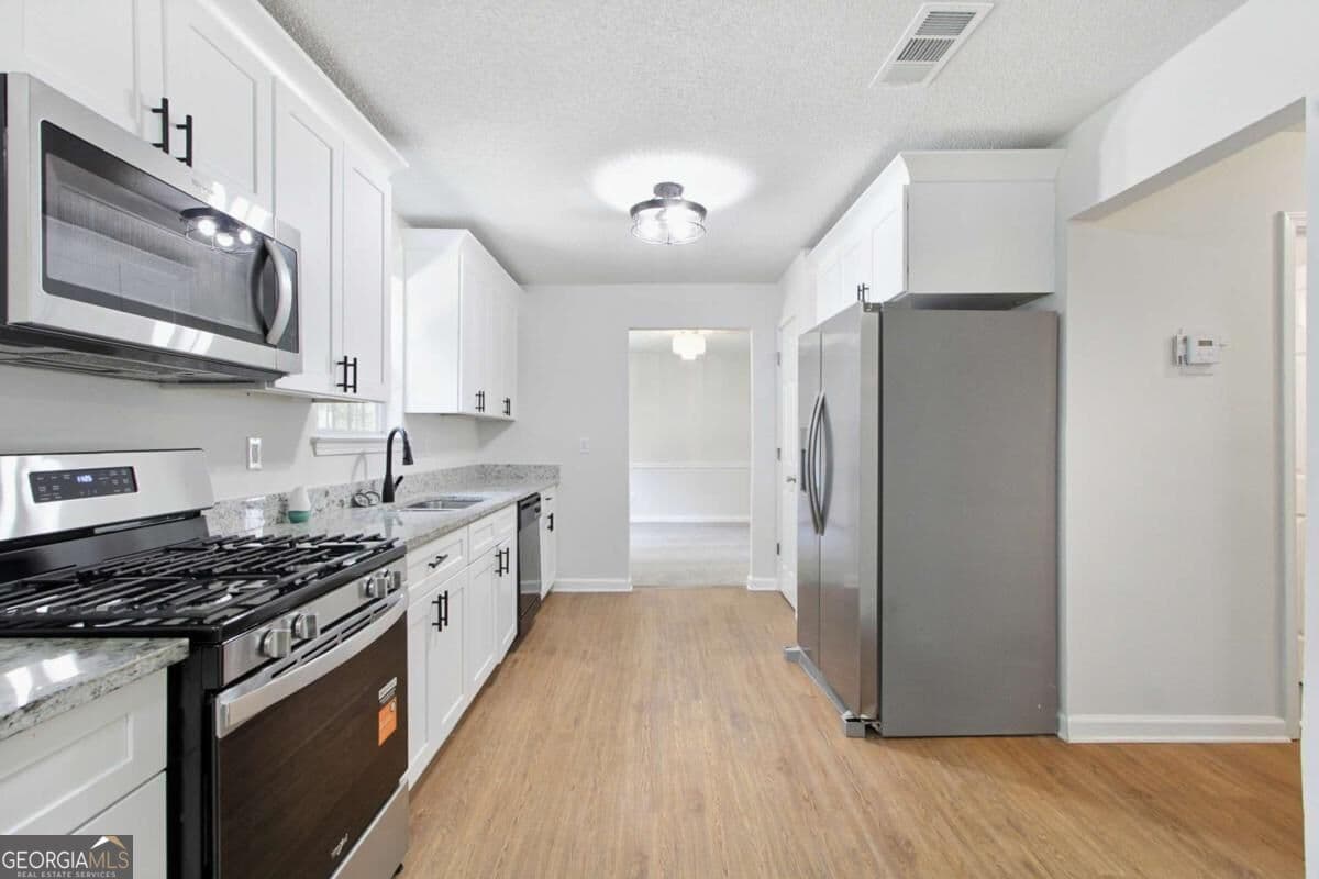 4 bedroom, 3 bathroom single family residence for sale at 2750 Green Marsh Court, Decatur, GA 30034 — photo 6