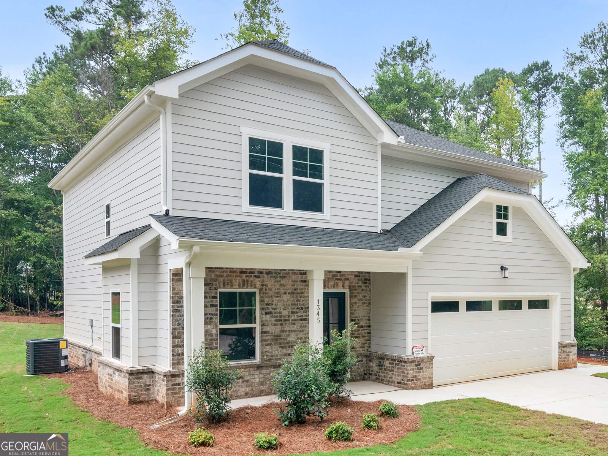 4 bedroom, 2.5 bathroom, 2,233 sq ft single family residence for sale at 1345 Johnson Road, Conyers, GA 30094 — photo 2