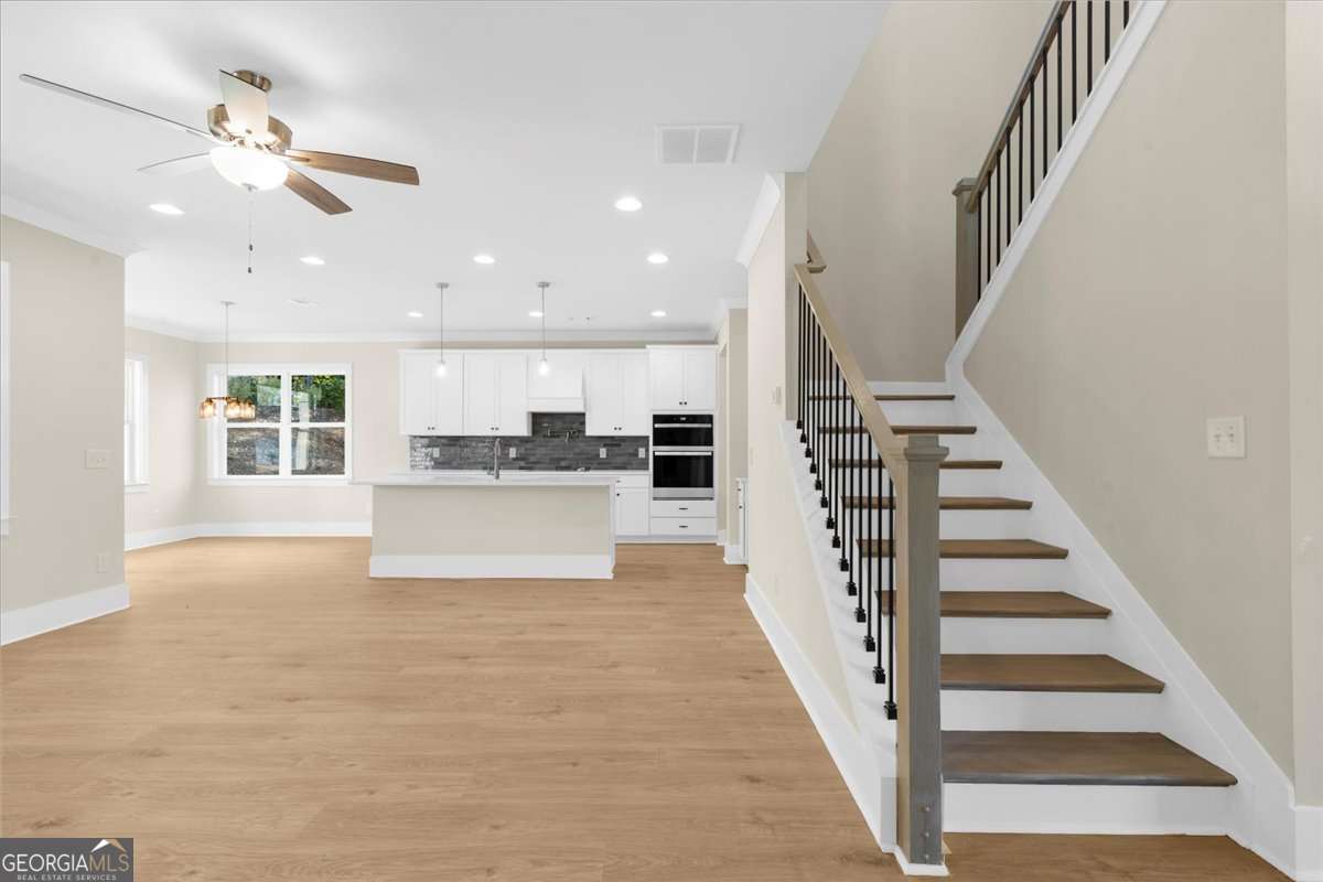 4 bedroom, 3 bathroom single family residence for sale at 5582 Overview Drive, Flowery Branch, GA 30542 — photo 9