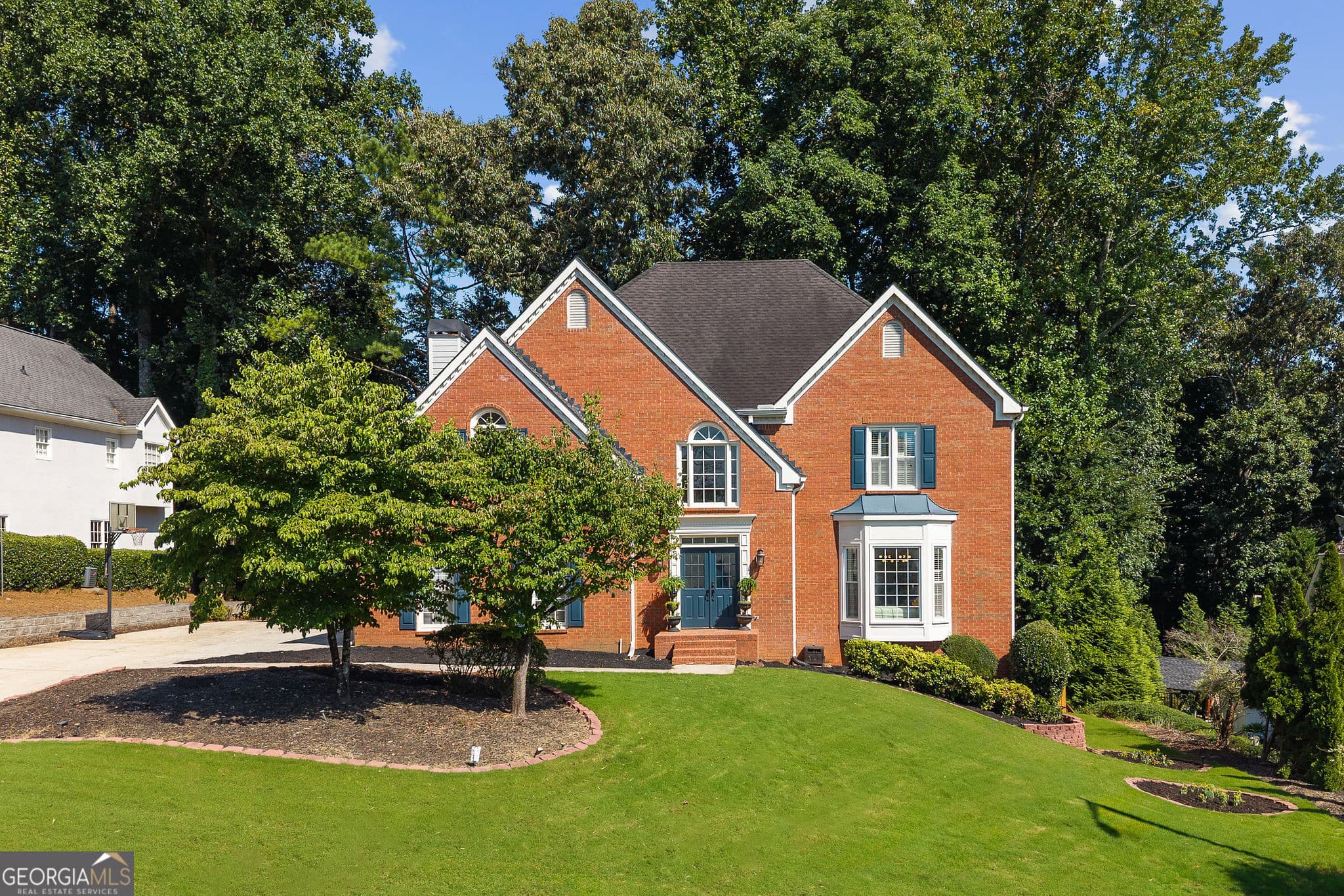 5 bedroom, 4.5 bathroom single family residence for sale at 10245 Groomsbridge Road, Johns Creek, GA 30022 — photo 3