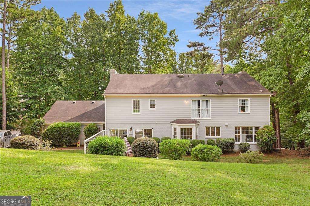 4 bedroom, 3.5 bathroom, 4,400 sq ft single family residence for sale at 2660 Spalding Drive, Atlanta, GA 30350 — photo 2