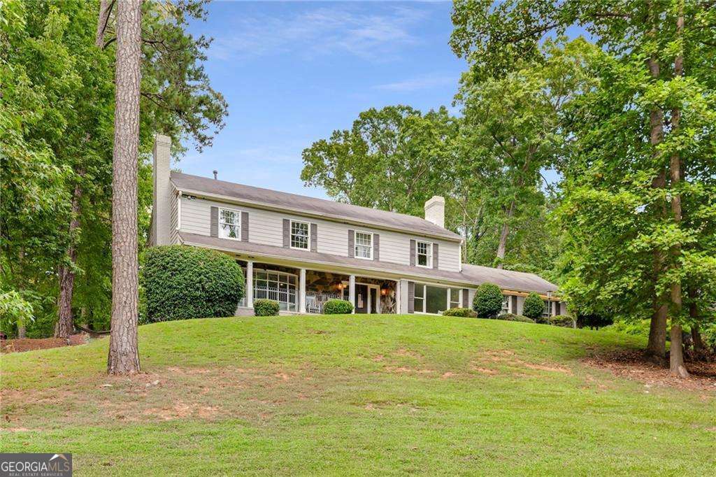 4 bedroom, 3.5 bathroom, 4,400 sq ft single family residence for sale at 2660 Spalding Drive, Atlanta, GA 30350 — photo 1 of 31