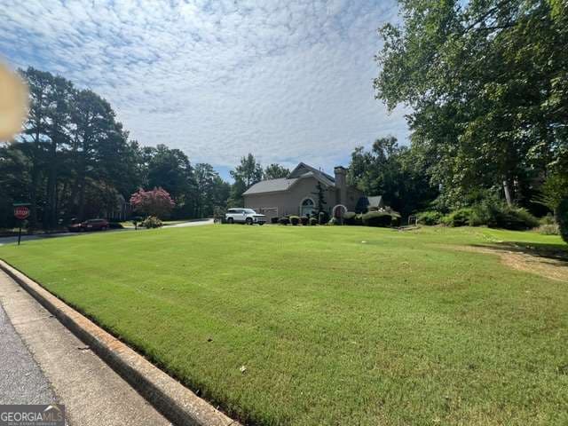 4 bedroom, 3.5 bathroom, 3,323 sq ft single family residence for sale at 12080 Magnolia Crescent Drive, Roswell, GA 30075 — photo 3