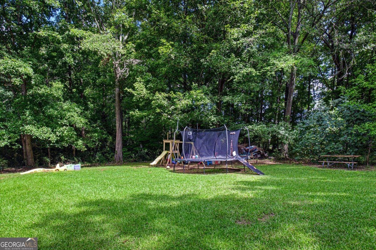 4 bedroom, 2.5 bathroom, 1,672 sq ft single family residence for sale at 110 Alcovy Way, Covington, GA 30014 — photo 4