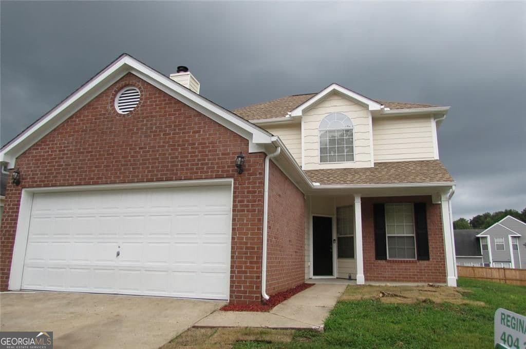 3 bedroom, 2.5 bathroom, 1,918 sq ft single family residence for sale at 5901 Ravensway Drive, Lithonia, GA 30058 — photo 1 of 19