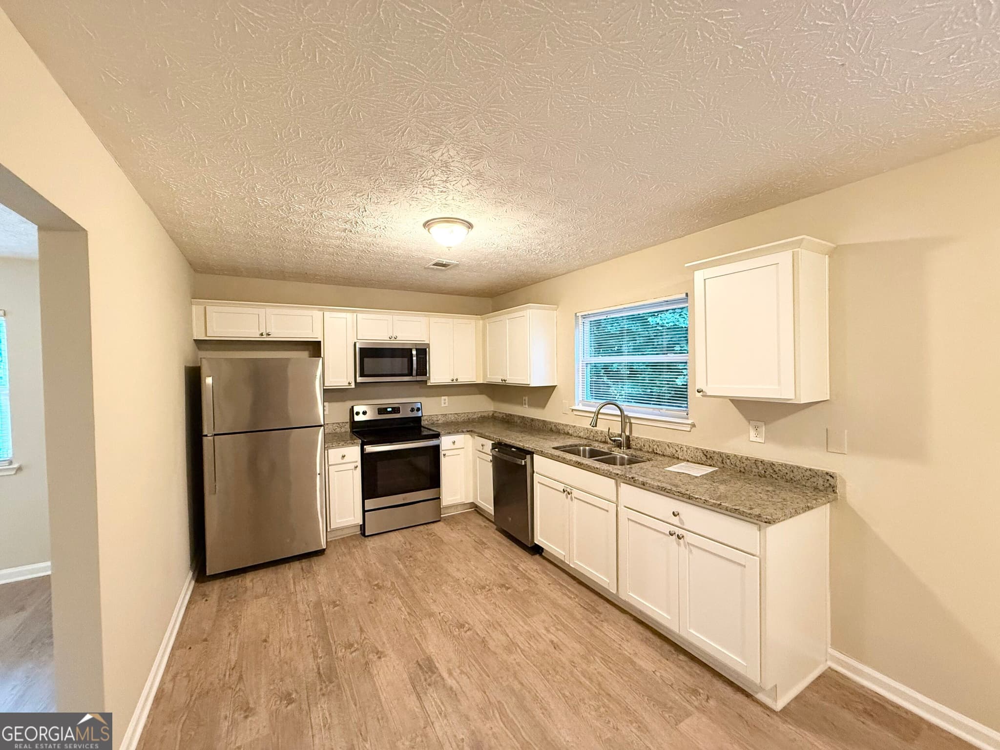 4 bedroom, 2.5 bathroom, 1,688 sq ft single family residence for sale at 3920 Melanie Woods Drive, South Fulton, GA 30349 — photo 7