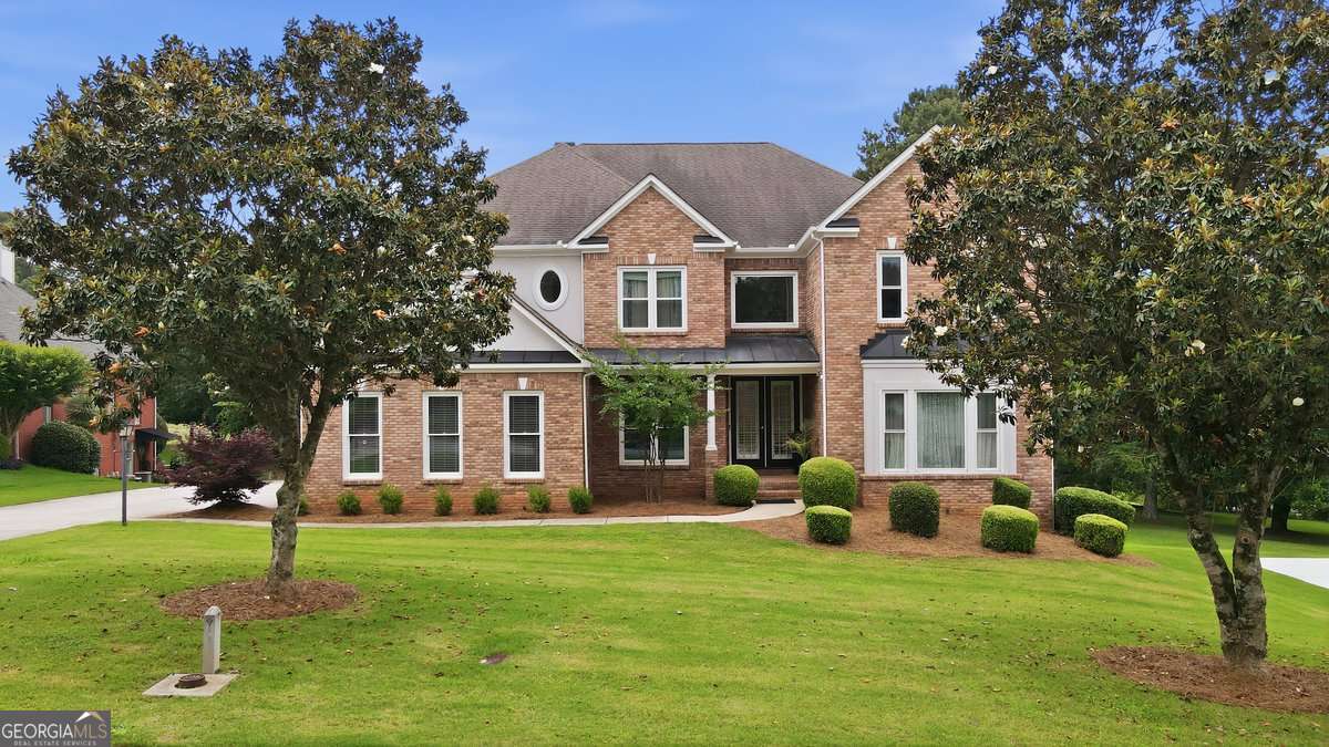 5 bedroom, 4 bathroom, 4,634 sq ft single family residence for sale at 705 Masters Drive, Stone Mountain, GA 30087 — photo 1 of 55