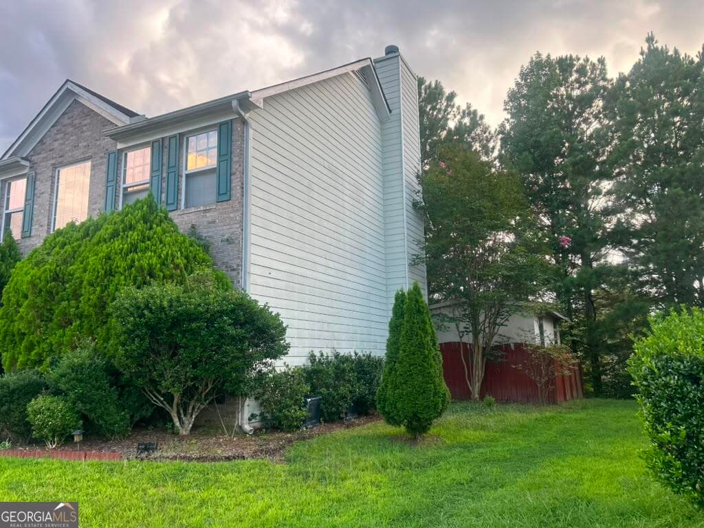 4 bedroom, 2.5 bathroom, 2,454 sq ft single family residence for sale at 5087 Upper Elm Street, Atlanta, GA 30349 — photo 2