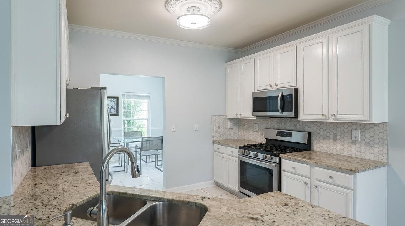 4 bedroom, 2.5 bathroom, 2,454 sq ft single family residence for sale at 5087 Upper Elm Street, Atlanta, GA 30349 — photo 3