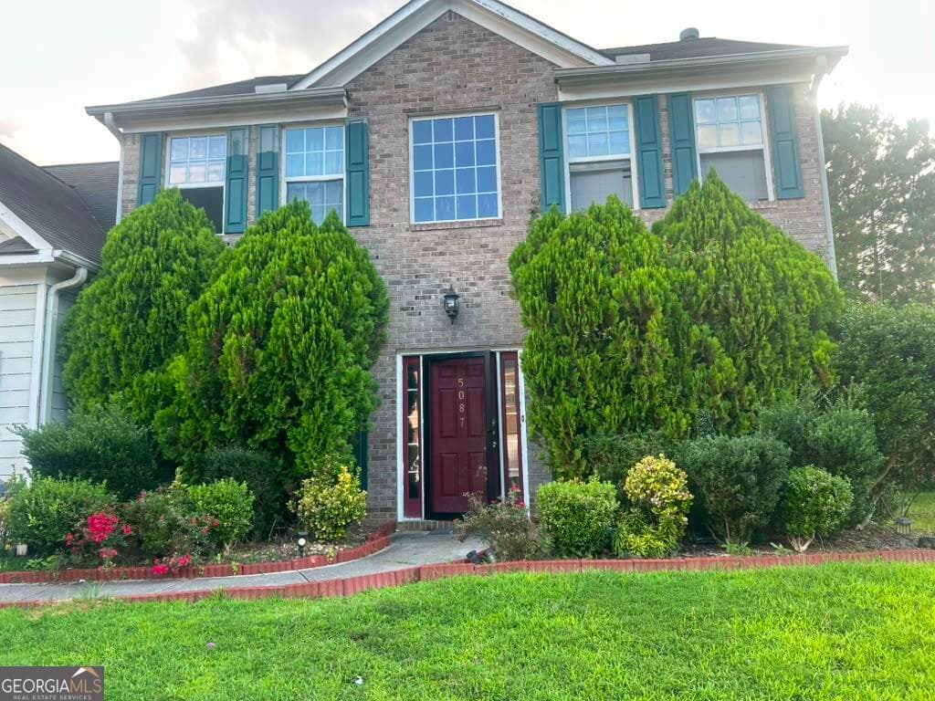 4 bedroom, 2.5 bathroom, 2,454 sq ft single family residence for sale at 5087 Upper Elm Street, Atlanta, GA 30349 — photo 1 of 20