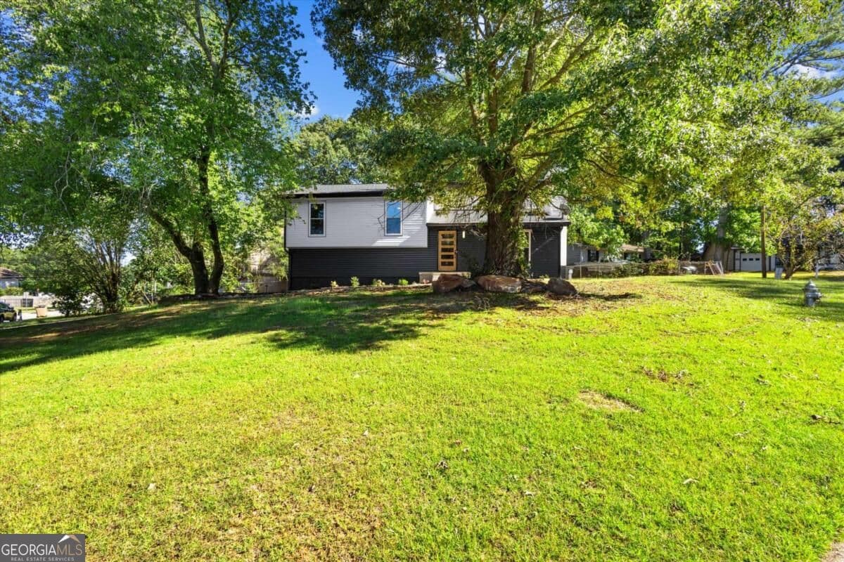 4 bedroom, 2 bathroom, 1,558 sq ft single family residence for sale at 3403 Hidden Lane, Rex, GA 30273 — photo 2