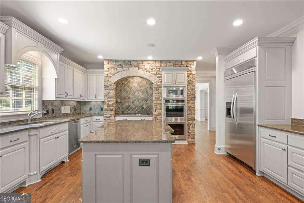 5 bedroom, 6 bathroom, 7,207 sq ft single family residence for sale at 2480 Flint Creek Drive, Cumming, GA 30041 — photo 7