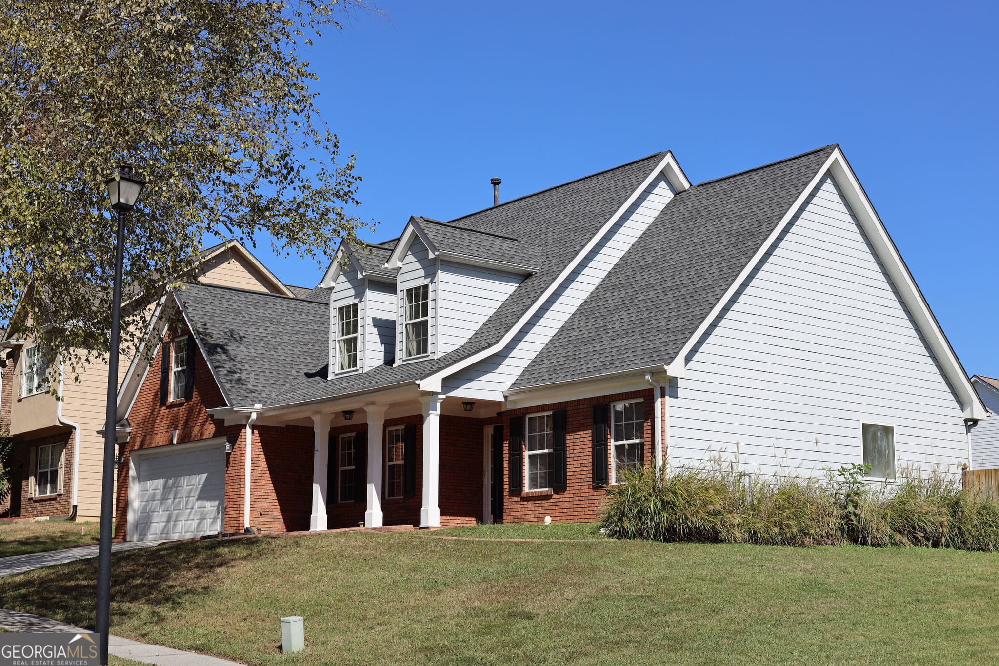 4 bedroom, 2.5 bathroom, 2,274 sq ft single family residence for sale at 4120 Savannah Ridge Trace, Loganville, GA 30052 — photo 3
