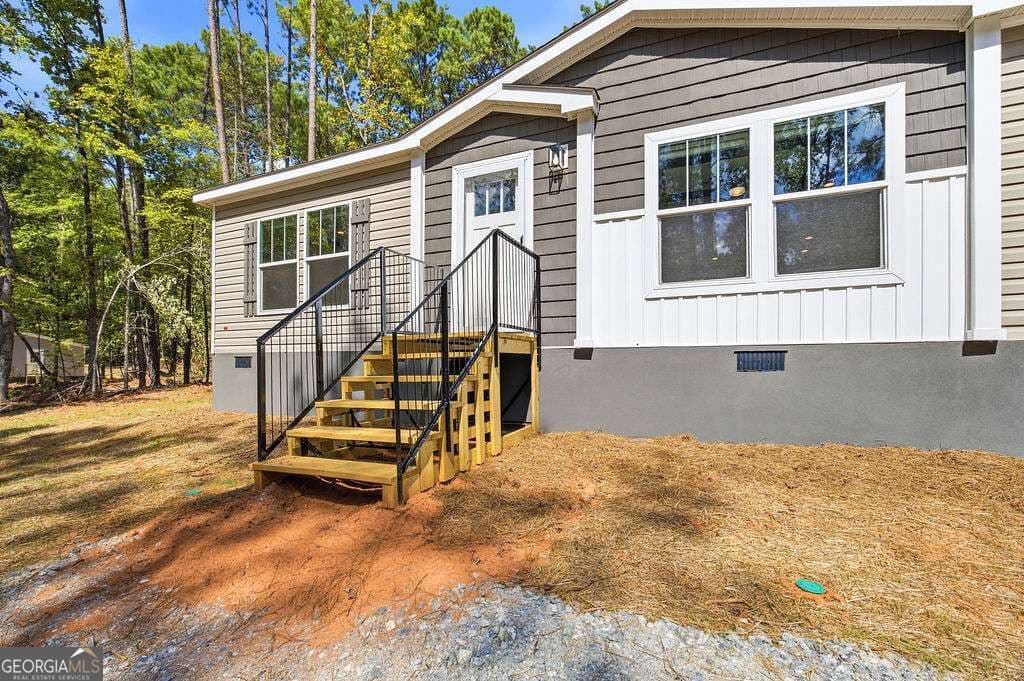 3 bedroom, 2 bathroom, 1,560 sq ft manufactured home,single family residence for sale at 205 S Steel Bridge Road, Eatonton, GA 31024 — photo 2