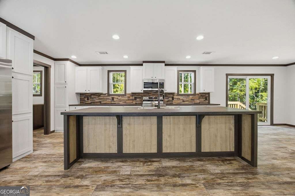 3 bedroom, 2 bathroom, 1,560 sq ft manufactured home,single family residence for sale at 205 S Steel Bridge Road, Eatonton, GA 31024 — photo 7