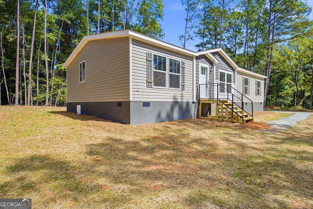 3 bedroom, 2 bathroom, 1,560 sq ft manufactured home,single family residence for sale at 205 S Steel Bridge Road, Eatonton, GA 31024 — photo 3