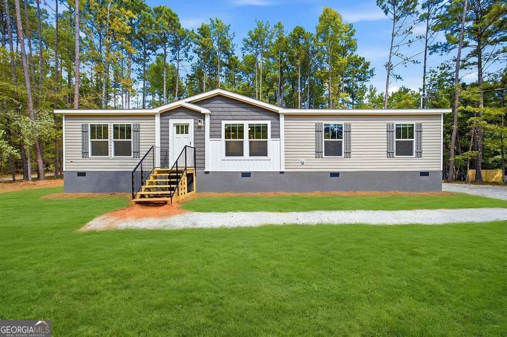 3 bedroom, 2 bathroom, 1,560 sq ft manufactured home,single family residence for sale at 205 S Steel Bridge Road, Eatonton, GA 31024 — photo 1 of 24
