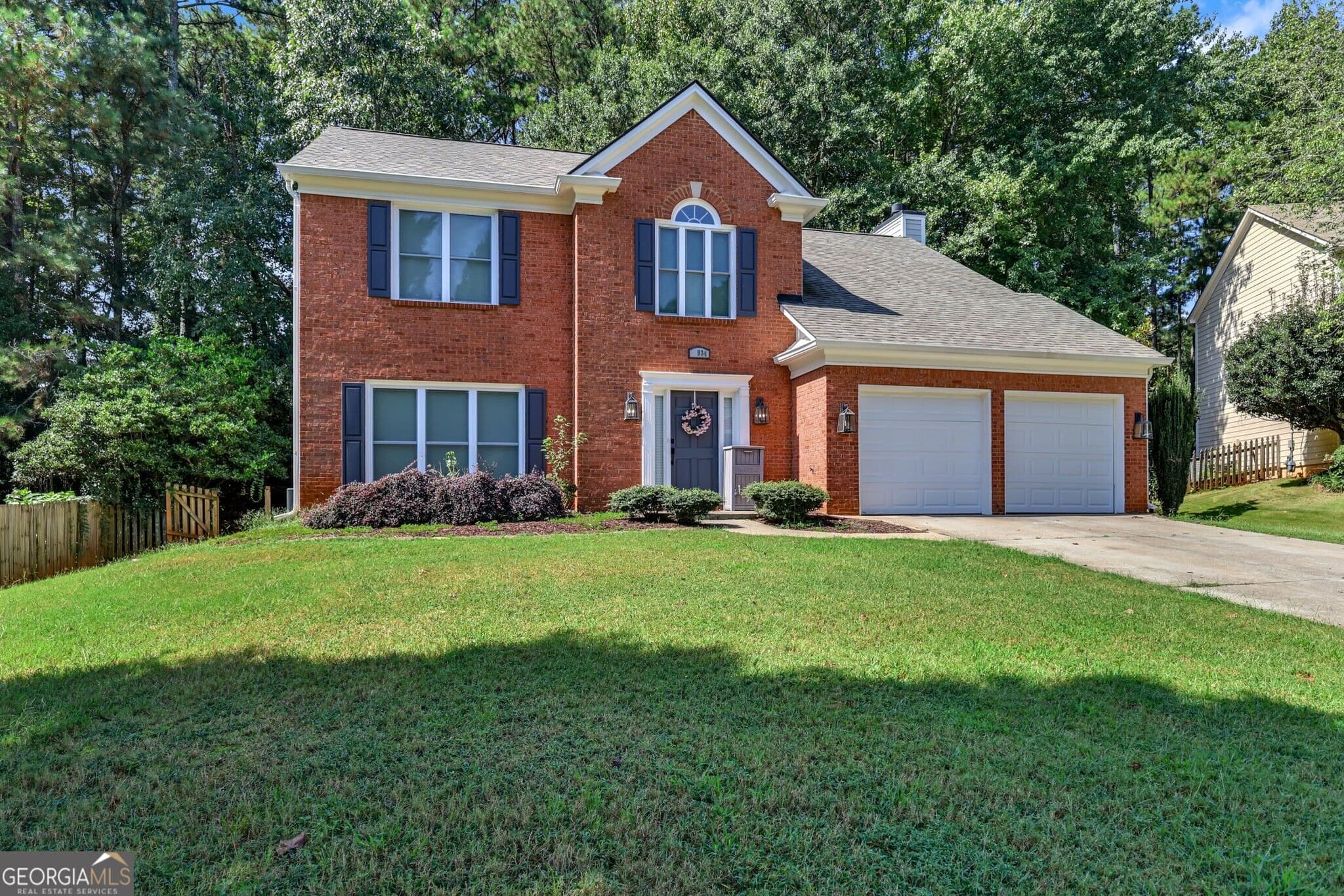 4 bedroom, 2.5 bathroom, 2,232 sq ft single family residence for sale at 1934 McLennon Court, Lawrenceville, GA 30043 — photo 1 of 33
