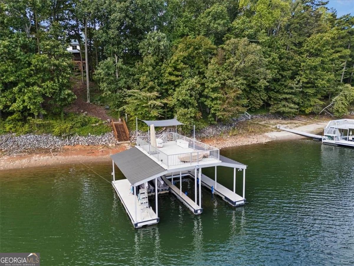 4 bedroom, 4.5 bathroom, 5,577 sq ft single family residence for sale at 5750 Cains Cove Road, Cumming, GA 30041 — photo 2