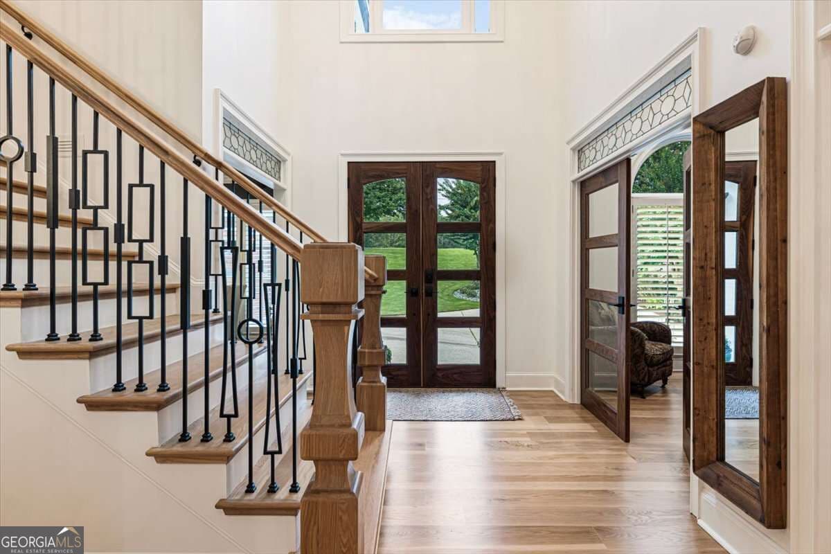 4 bedroom, 4.5 bathroom, 5,577 sq ft single family residence for sale at 5750 Cains Cove Road, Cumming, GA 30041 — photo 6