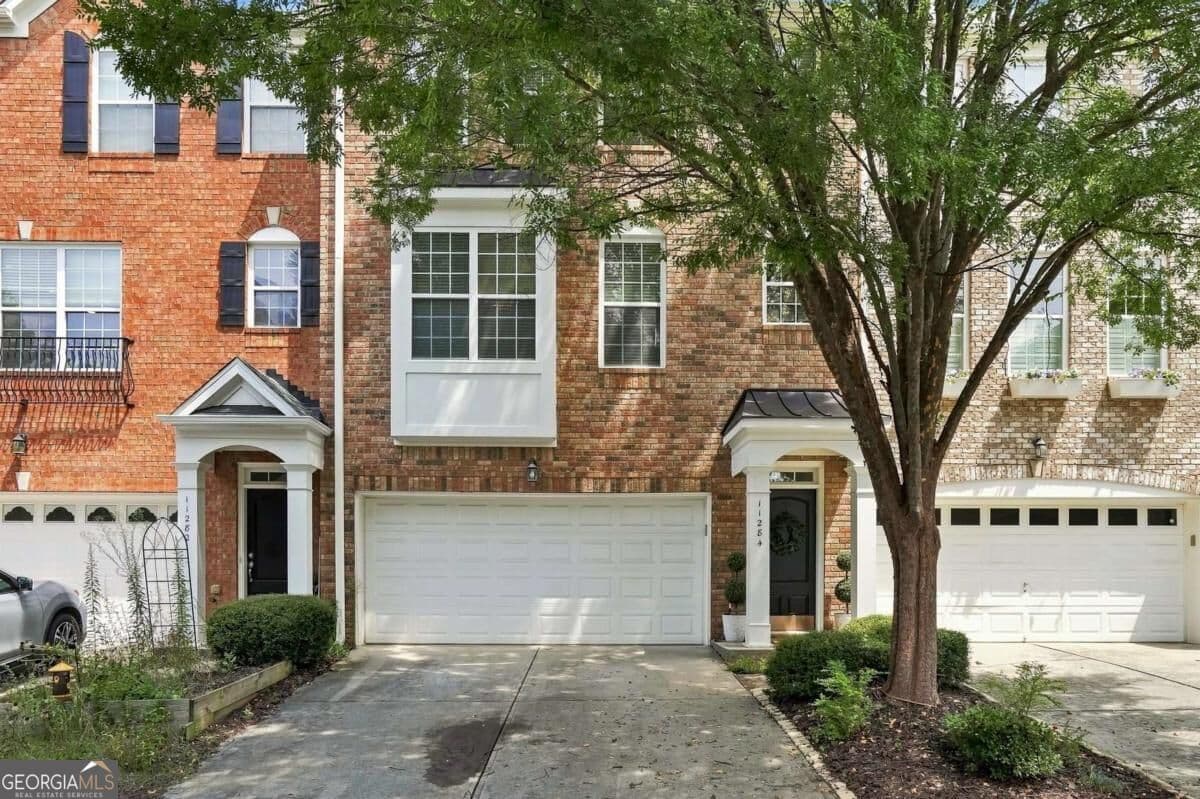 4 bedroom, 2.5 bathroom, 2,488 sq ft townhouse for sale at 11284 Musette Circle, Alpharetta, GA 30009