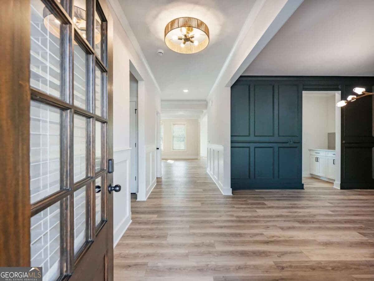 5 bedroom, 4 bathroom, 3,243 sq ft single family residence for sale at 4260 Hosch Reserve Drive, Buford, GA 30519 — photo 2