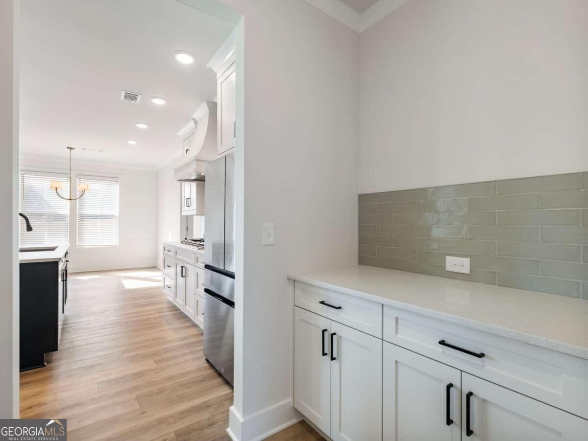 5 bedroom, 4 bathroom, 3,243 sq ft single family residence for sale at 4260 Hosch Reserve Drive, Buford, GA 30519 — photo 5