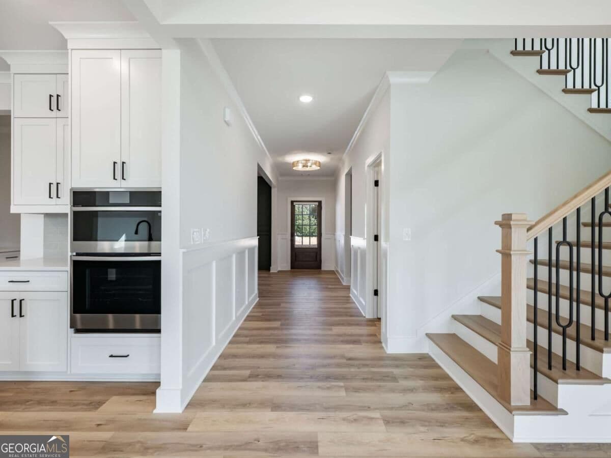 5 bedroom, 4 bathroom, 3,243 sq ft single family residence for sale at 4260 Hosch Reserve Drive, Buford, GA 30519 — photo 8
