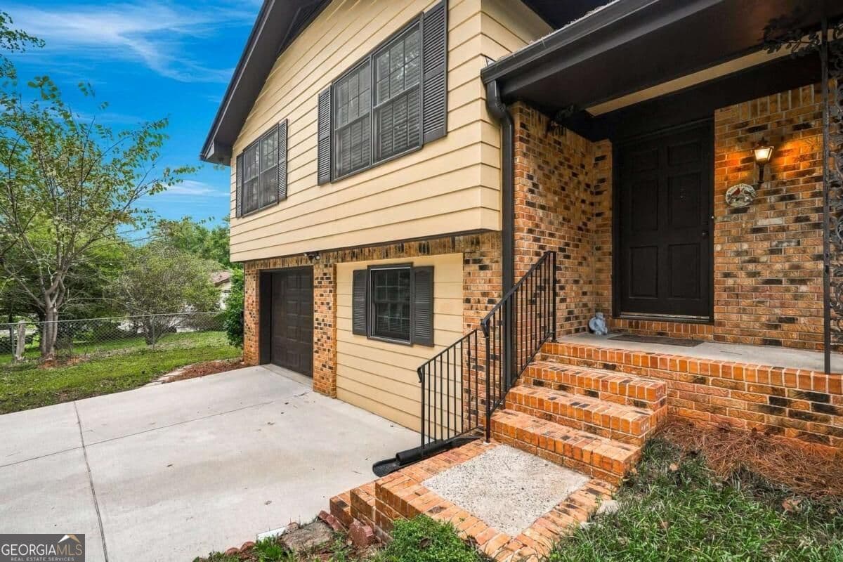 4 bedroom, 2 bathroom, 1,585 sq ft single family residence for sale at 3450 Lake Drive, Lawrenceville, GA 30044 — photo 3