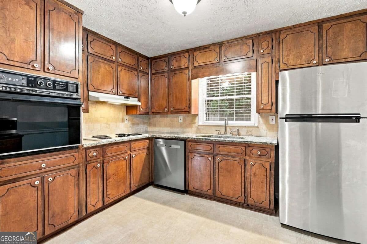 4 bedroom, 2 bathroom, 1,585 sq ft single family residence for sale at 3450 Lake Drive, Lawrenceville, GA 30044 — photo 9