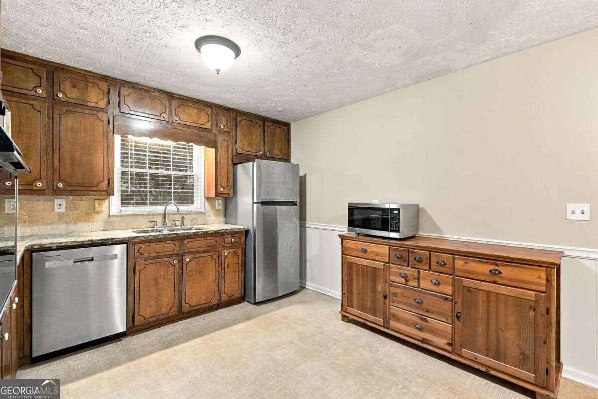 4 bedroom, 2 bathroom, 1,585 sq ft single family residence for sale at 3450 Lake Drive, Lawrenceville, GA 30044 — photo 10