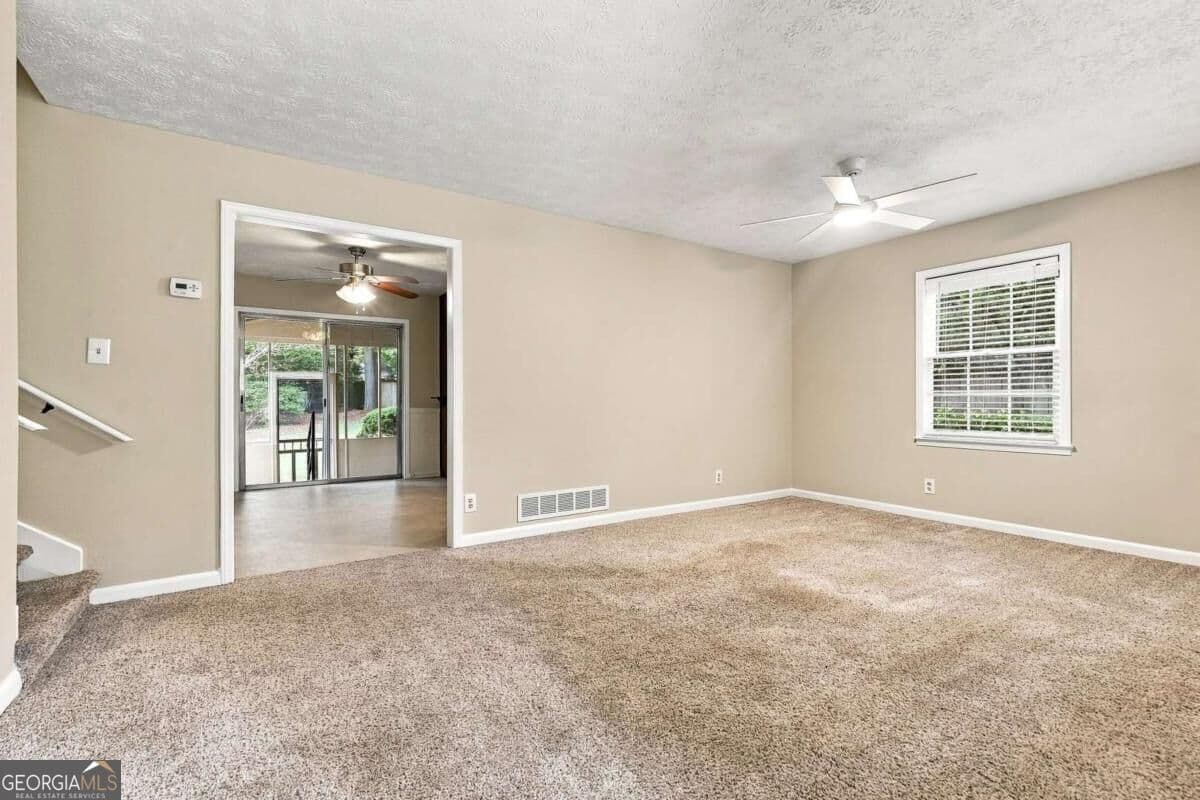 4 bedroom, 2 bathroom, 1,585 sq ft single family residence for sale at 3450 Lake Drive, Lawrenceville, GA 30044 — photo 4