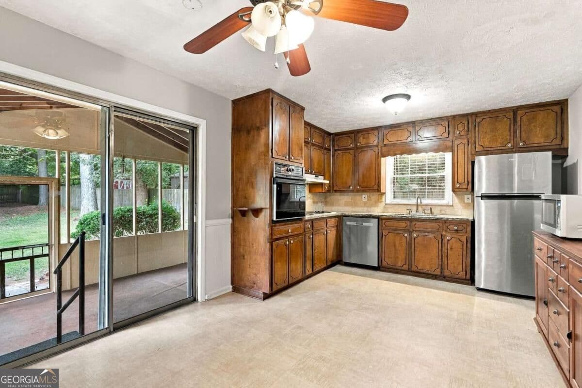 4 bedroom, 2 bathroom, 1,585 sq ft single family residence for sale at 3450 Lake Drive, Lawrenceville, GA 30044 — photo 8