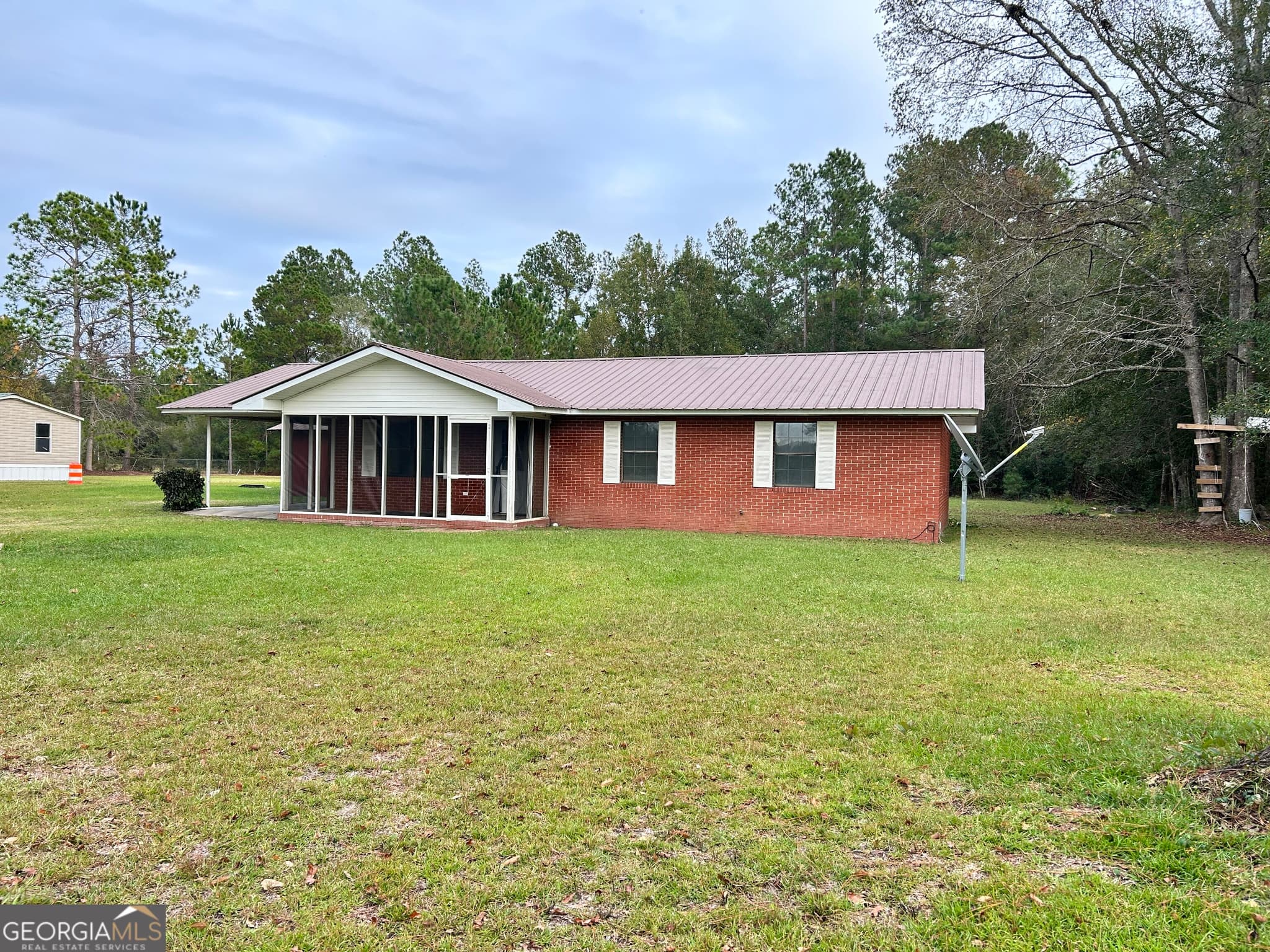 3 bedroom, 2 bathroom, 1,144 sq ft single family residence for sale at 7008 White Bluff Rd., Glennville, GA 30427 — photo 2