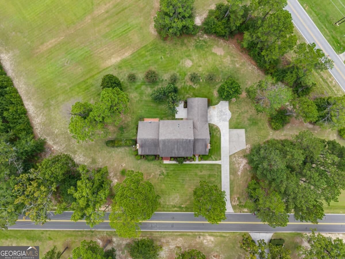 5 bedroom, 4.5 bathroom, 6,515 sq ft single family residence for sale at 313 Miller Street, Statesboro, GA 30458 — photo 2