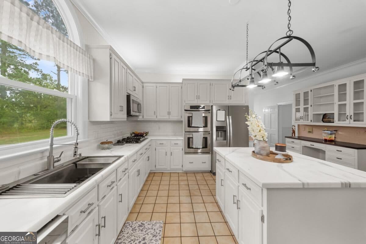 5 bedroom, 4.5 bathroom, 6,515 sq ft single family residence for sale at 313 Miller Street, Statesboro, GA 30458 — photo 4