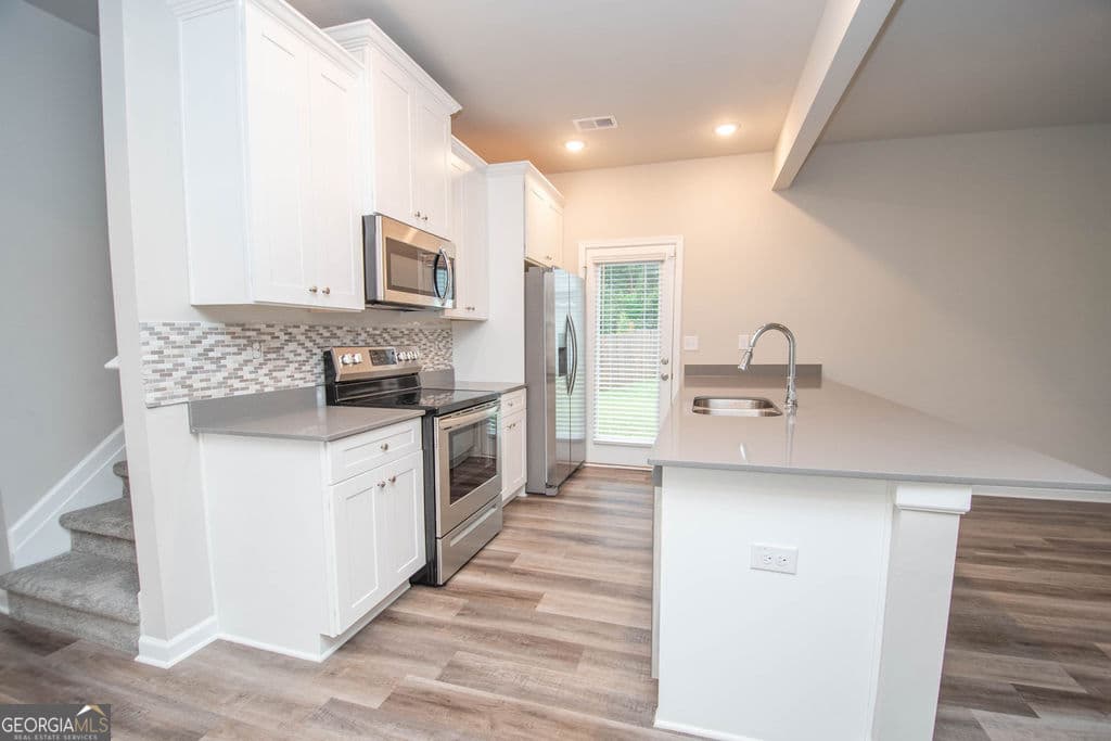 3 bedroom, 2 bathroom, 1,322 sq ft single family residence for sale at 107 Hidden Hills Drive, Carrollton, GA 30117 — photo 7
