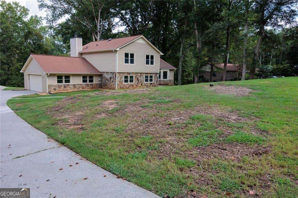4 bedroom, 2.5 bathroom, 3,043 sq ft single family residence for sale at 551 Covered Bridge Trail, Fayetteville, GA 30214 — photo 2