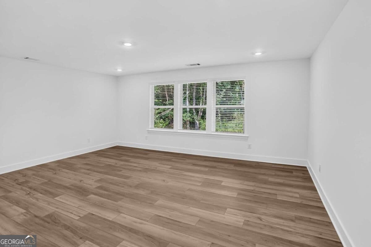 5 bedroom, 4 bathroom, 3,700 sq ft single family residence for sale at 4530 Manning Drive, Cumming, GA 30028 — photo 5