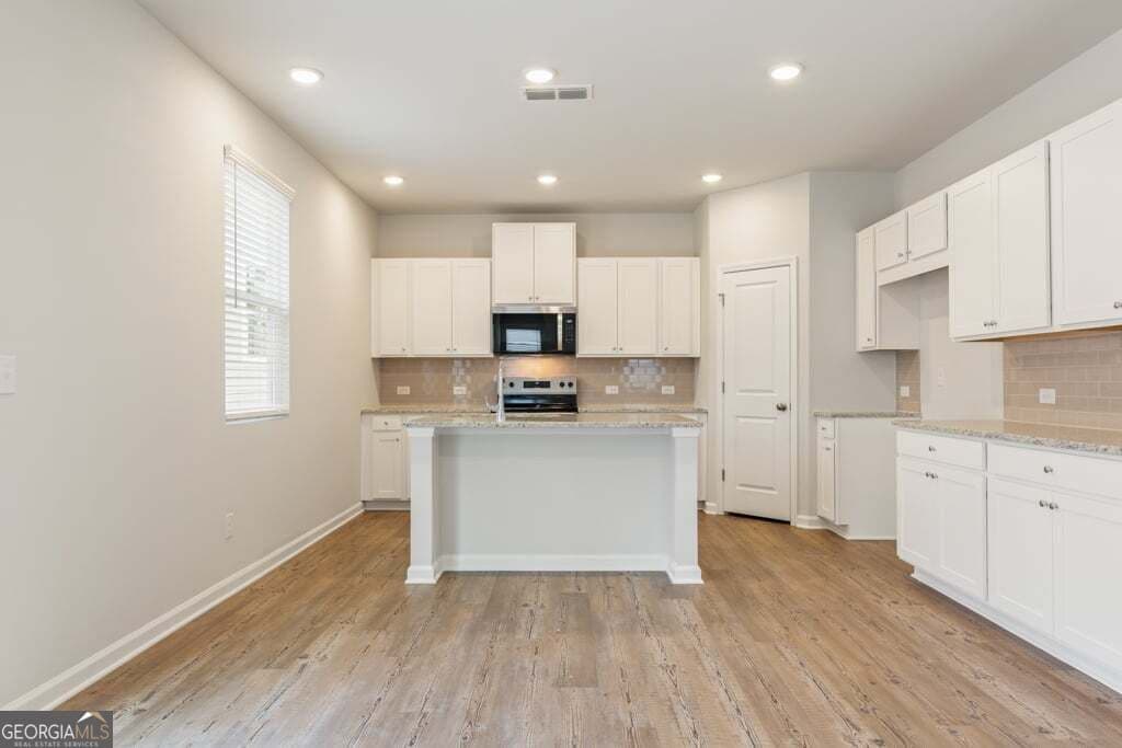4 bedroom, 4 bathroom, 2,343 sq ft single family residence for sale at 8039 Dickens Drive, Fairburn, GA 30213 — photo 7
