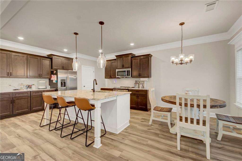 4 bedroom, 3 bathroom, 2,423 sq ft single family residence for sale at 706 Lindsey Brooke Trace, Bonaire, GA 31005 — photo 5