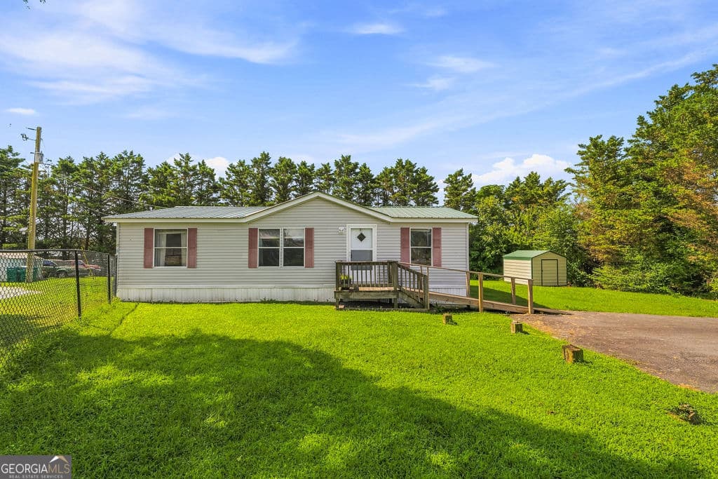 3 bedroom, 2 bathroom, 1,344 sq ft manufactured home,single family residence for sale at 2092 Sand Rock Avenue, Sand Rock, AL 35983 — photo 2
