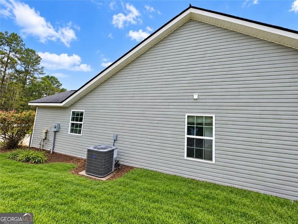 3 bedroom, 2 bathroom, 1,215 sq ft single family residence for sale at 214 Archer Road, Guyton, GA 31312 — photo 4