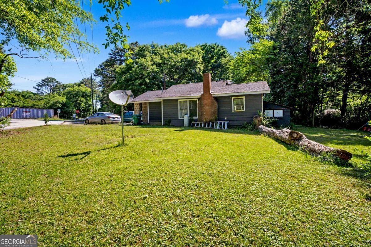 6 bedroom, 1 bathroom, 1,600 sq ft single family residence for sale at 4056 Church Street, Conley, GA 30288 — photo 3