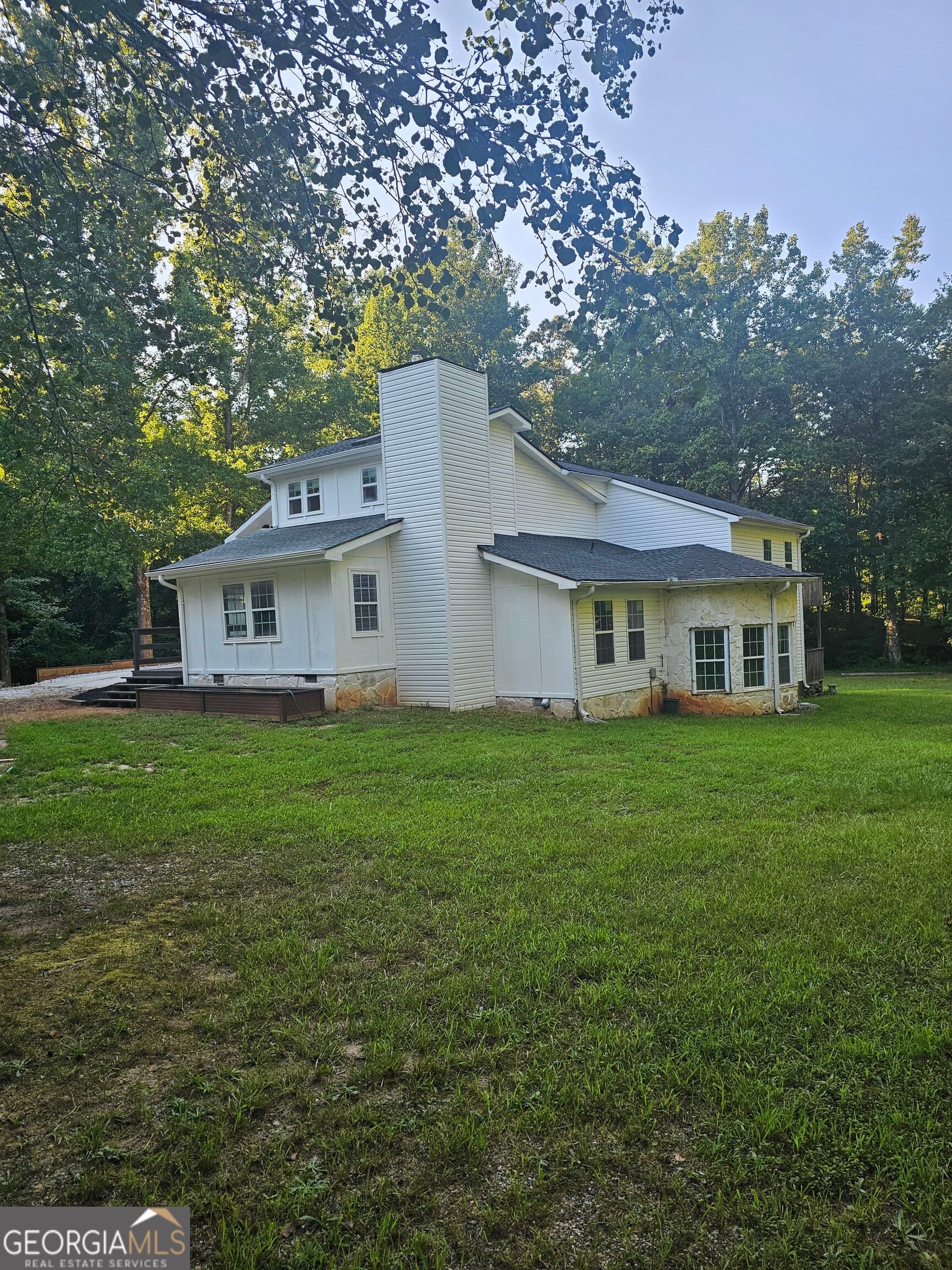 4 bedroom, 3 bathroom, 3,462 sq ft single family residence for sale at 3300 Stewart Lake Road, Monroe, GA 30655 — photo 2