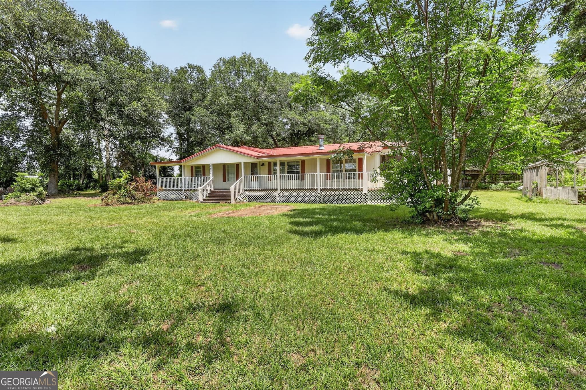 4 bedroom, 2 bathroom, 1,560 sq ft manufactured home,single family residence for sale at 2224 Howard Alexander Road, Collins, GA 30421 — photo 2
