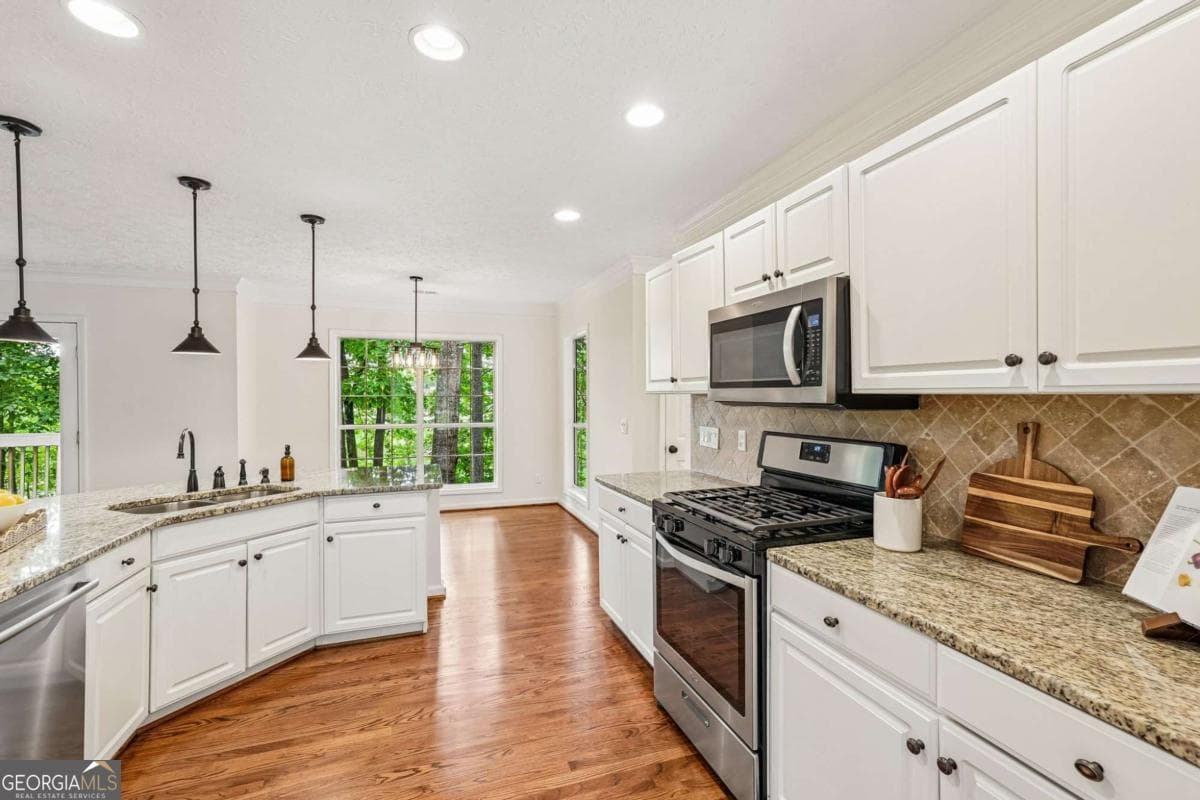 4 bedroom, 2.5 bathroom, 4,000 sq ft single family residence for sale at 5520 Tallantworth Trail, Cumming, GA 30040 — photo 9